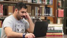 Saudi student studying in the library